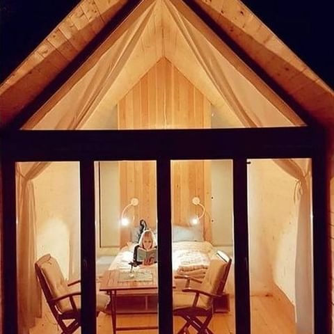 Quiet evening, comfortable cabin, relaxing smell of wood, enjoyable book. So precious.  . 📷  @anni_dorfer  📍 @[165495316892202:274:Kamp Koren]  . . . #lushnacabin #glamping #glampinglife #glampingcabins #weekendretreat #cabinlove #cabinvibes #cabinlife #natureresort #greatoutdoor #sustainablegetaways #socialdistancingtravel #ifeelslovenia #arhitecturaldesign #interierdesign